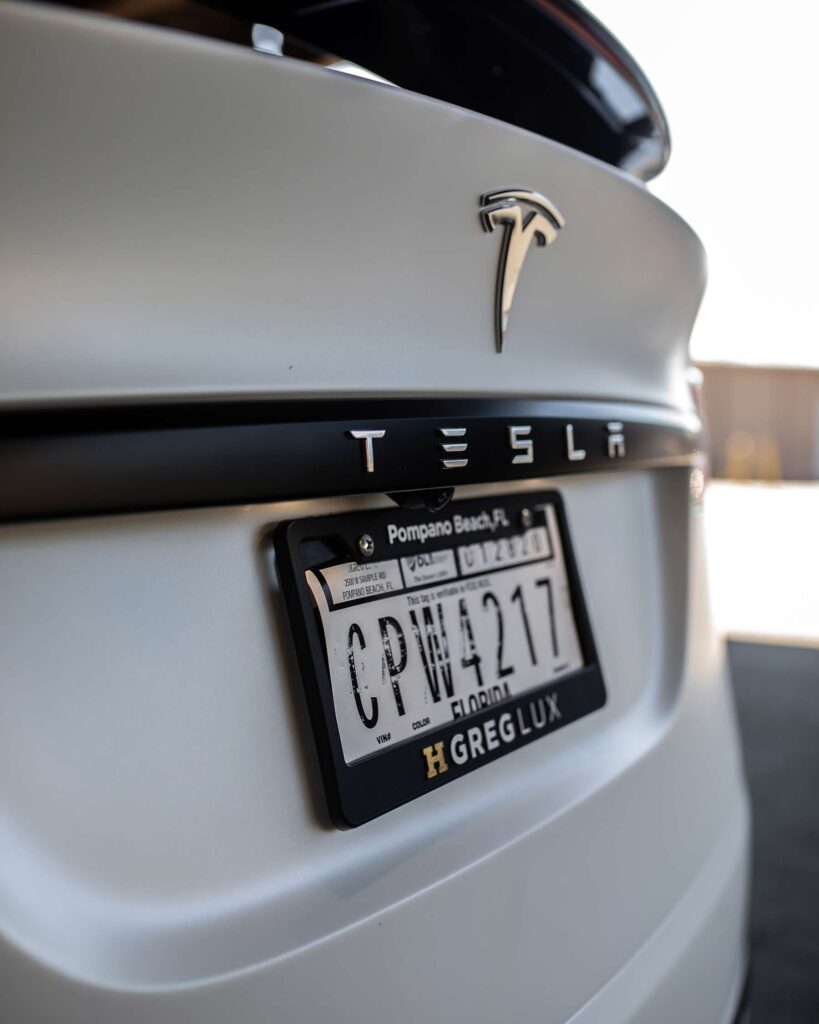 back of a white tesla with paint protection