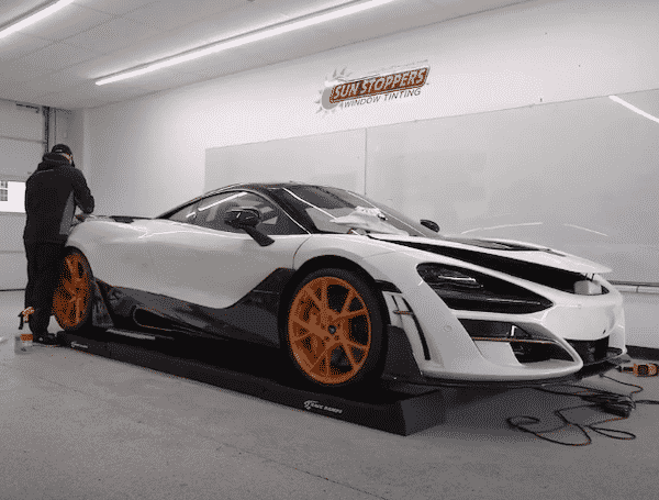 car getting ceramic coating in a Sun Stopper's shop