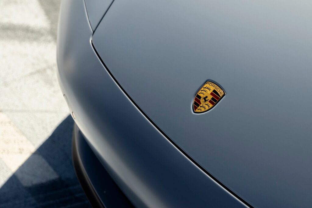 Porsche logo on gray car