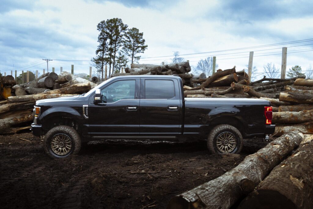 blue truck in a lumber yard