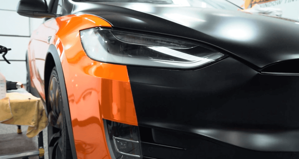 black and orange tesla with fresh ppf