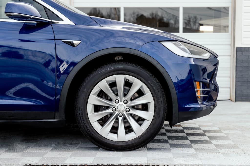 blue Tesla with a new layer of paint protection film