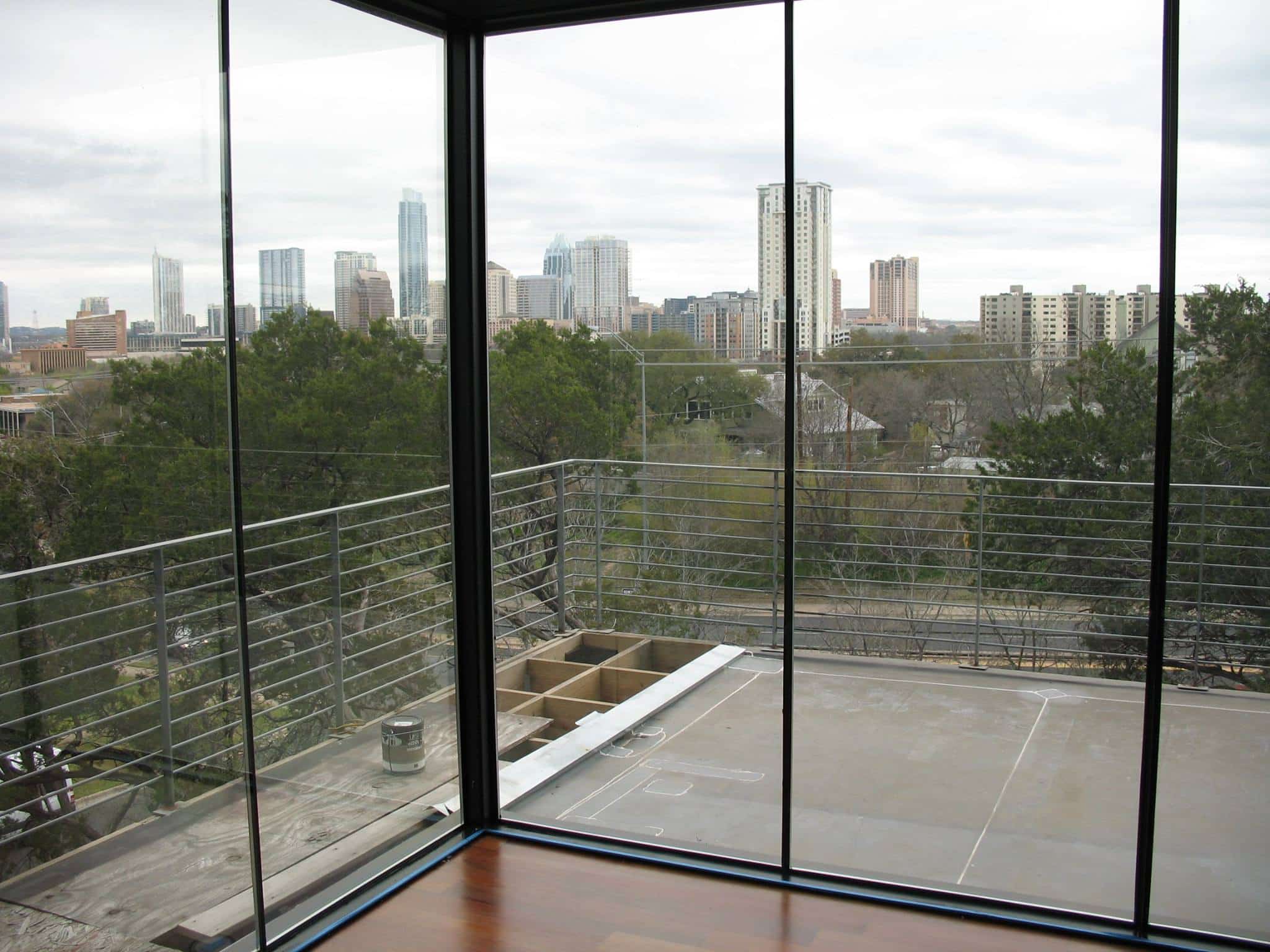 Tinted windows with a city skyline in the background.