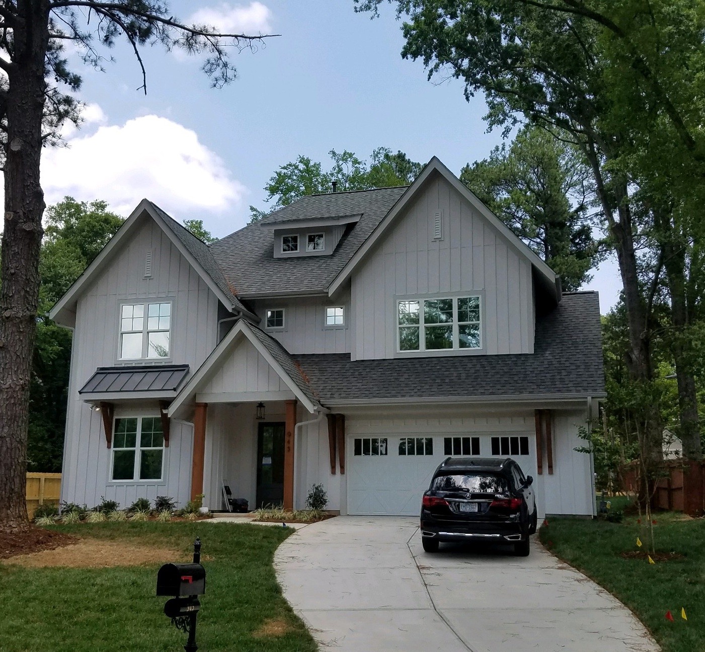 A gray home with a fresh window tint from sun stoppers