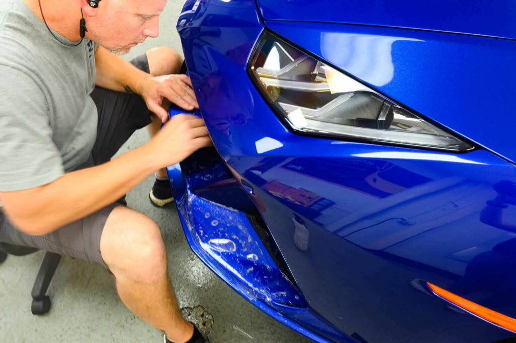 a blue sports car with fresh paint protection film