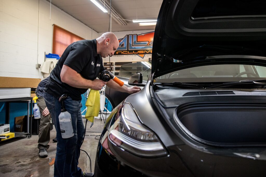 applying paint protection film to a black car