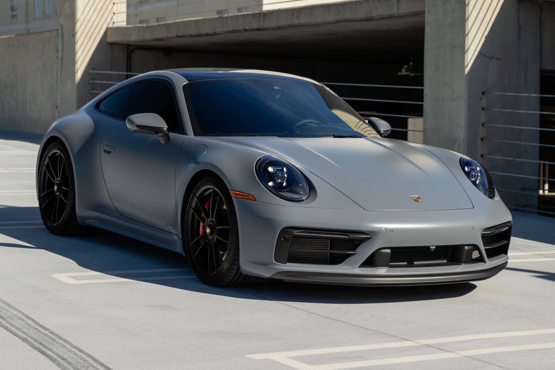 gray porsche with tinted windows