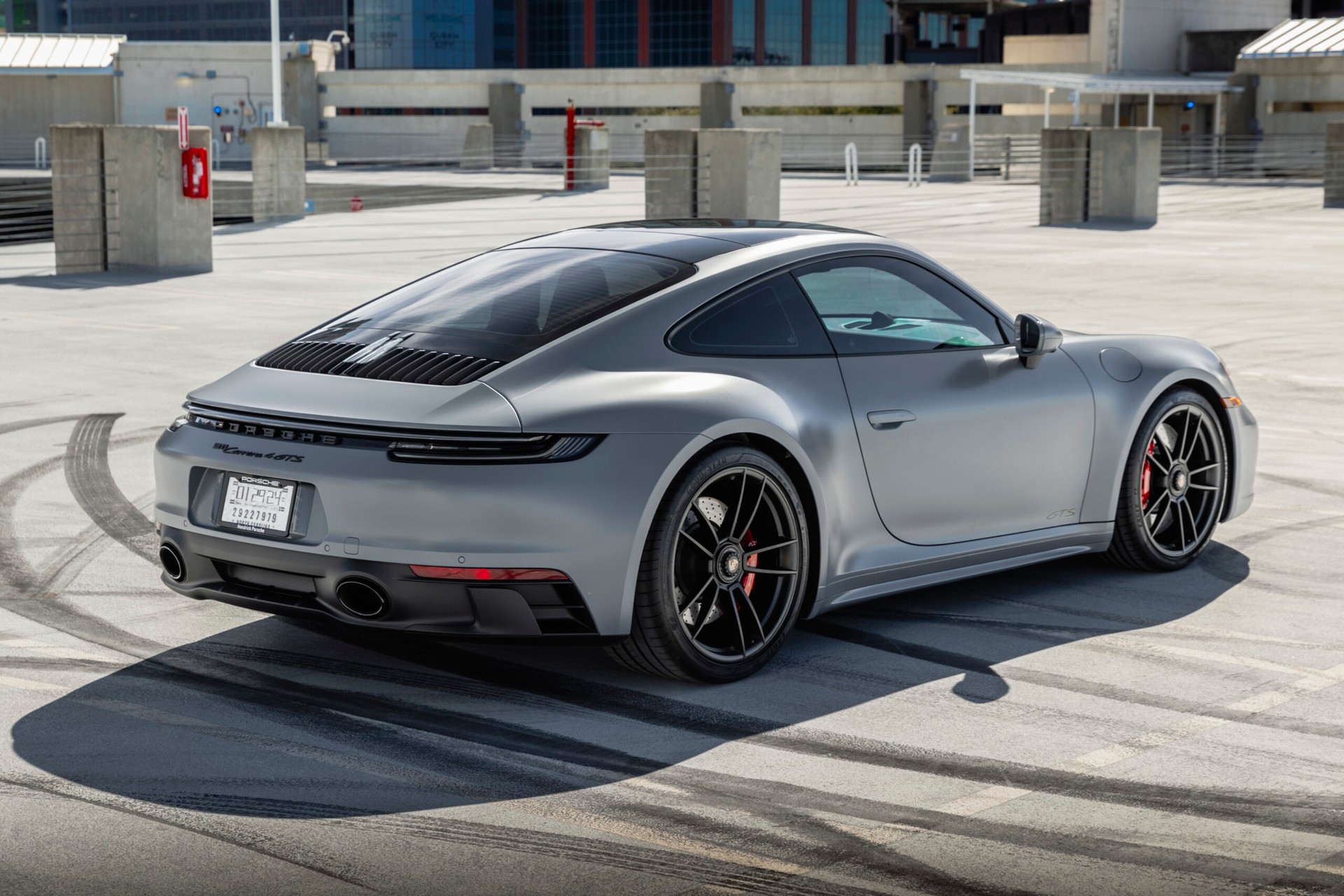 rear angled view of tinted porsche outside